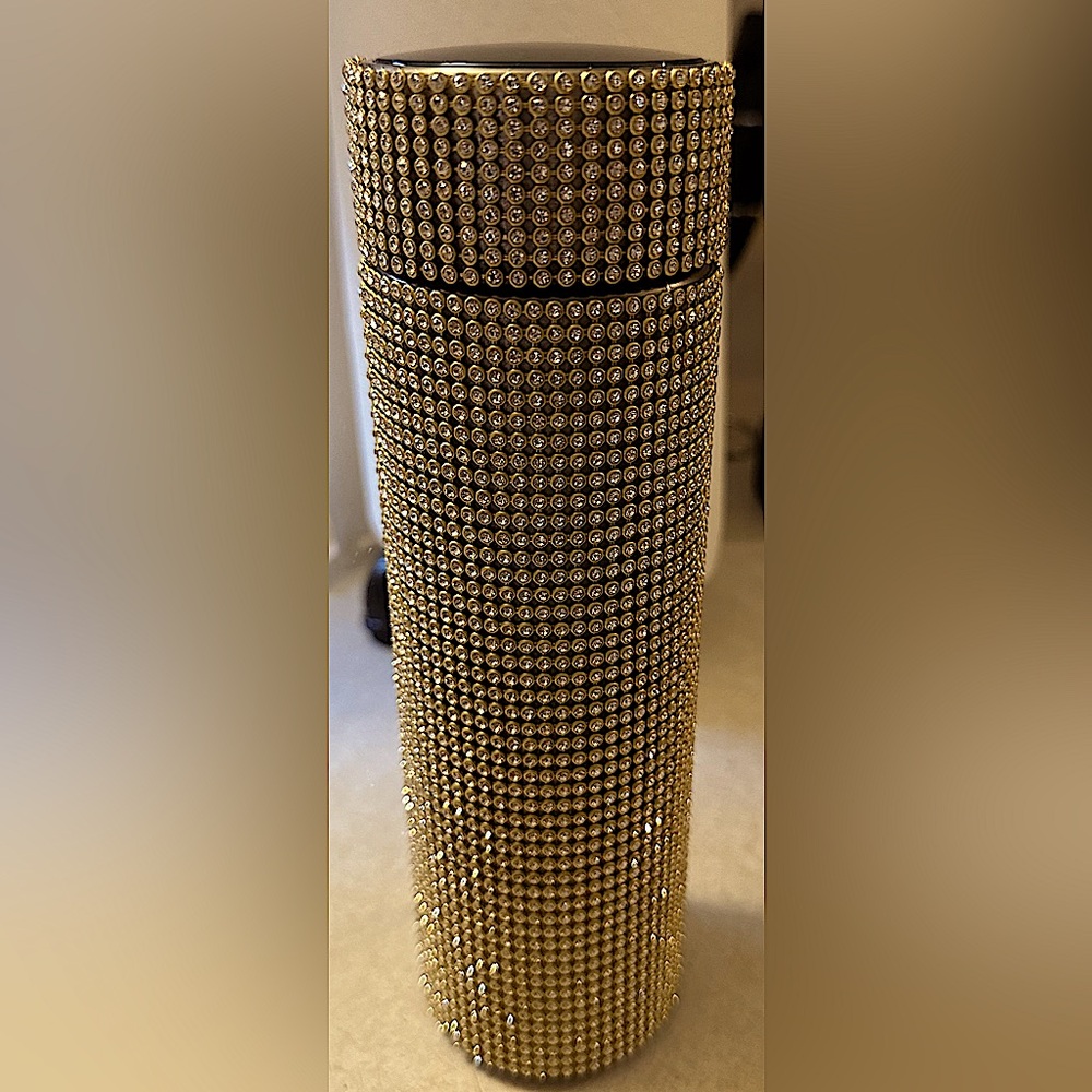 Smart bottle dripping in diamond look-a-likes set in gold!!!